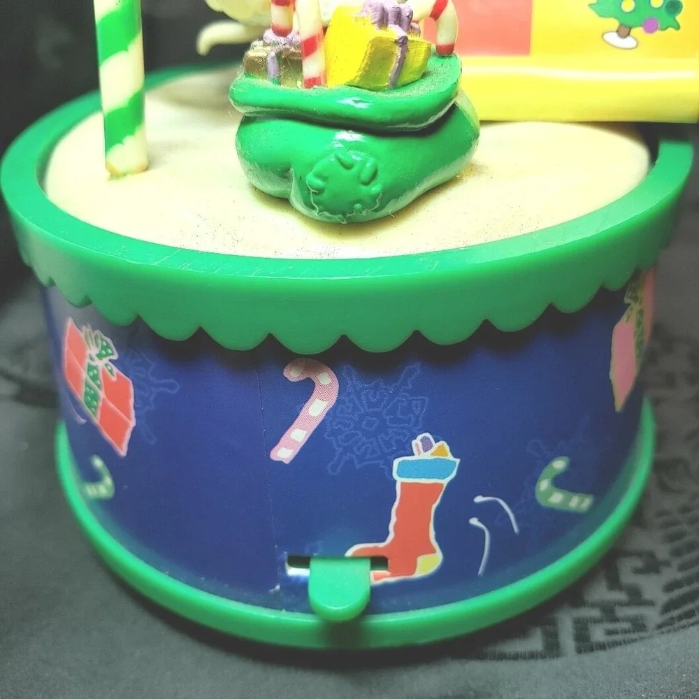 Snoopy as Santa checking his List‎ Music Box Play We Wish You A Merry Christmas